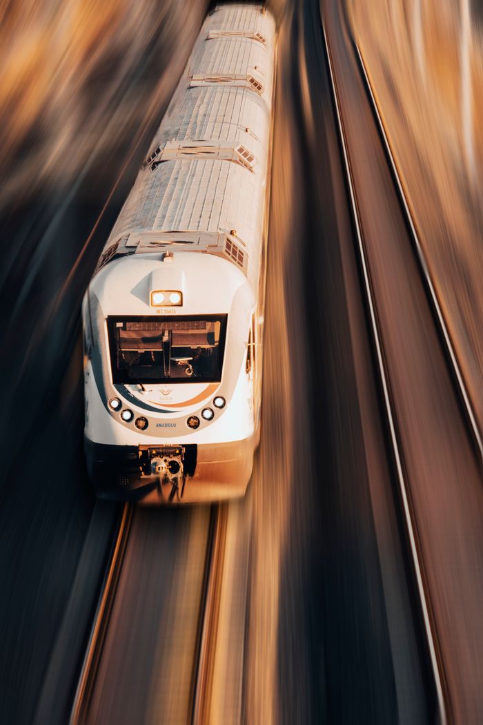 Services A high-speed train captured from above, showcasing dynamic motion in Karaman, Türkiye.